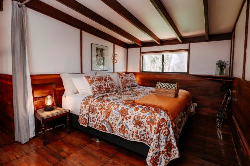 a bedroom with a bed and a window at Cottage 1 - The Row in Forest Grove