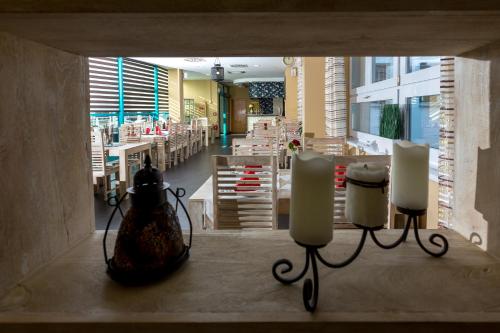 a view of a restaurant with candles and tables at Sareza hotel in Ostrava