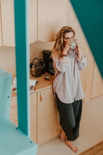 a woman taking a picture of herself in a mirror at Błogostan in Jodłów