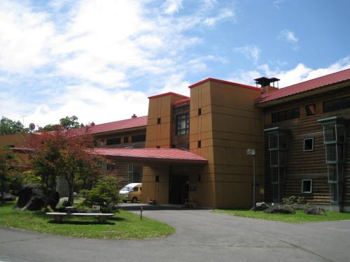 a building with a statue of a cow in front of it at Chuzenji Kanaya Hotel in Nikko