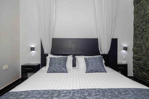 Mirembe Hotels - Source of the Nile Suitesにあるベッド