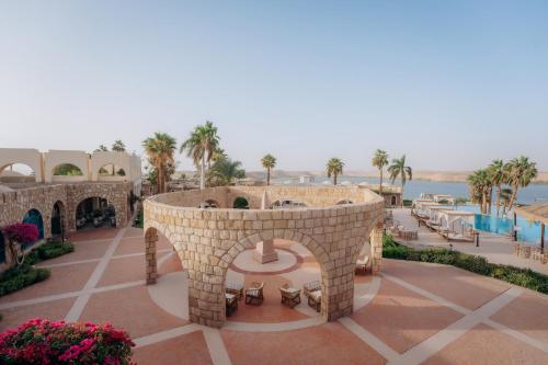 arial view of a resort with a pool and palm trees at Seti Abu Simbel Lake Resort in Abu Simbel