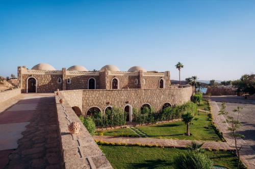 a building with domes on the side of it at Seti Abu Simbel Lake Resort in Abu Simbel