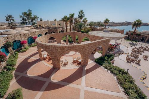 an aerial view of a resort with a patio at Seti Abu Simbel Lake Resort in Abu Simbel