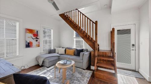 a living room with a couch and a staircase at Charming Condo with City Views 5857 in Punta Gorda