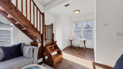 a living room with a staircase and a couch at Charming Condo with City Views 5857 in Punta Gorda