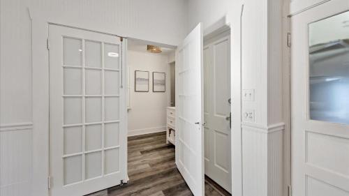 a white walk in closet with white doors at Charming Condo with City Views 5857 in Punta Gorda