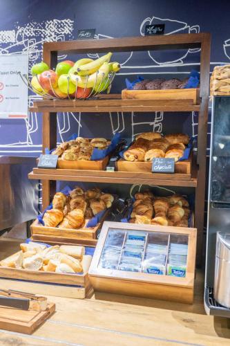 a bakery with lots of different types of bread and pastries at ibis budget London Barking in Barking