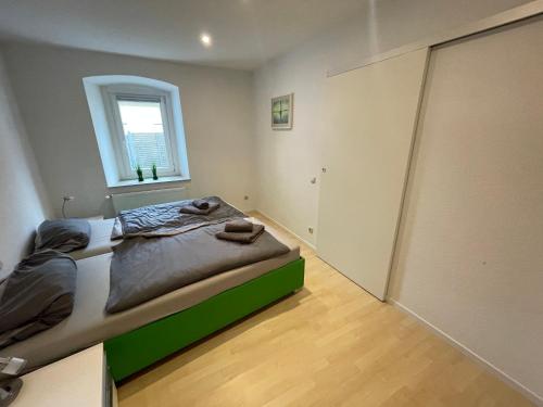Postel nebo postele na pokoji v ubytování Gemütliches Appartement nähe Zentrum mit Küche