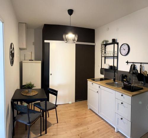 a kitchen with a table and a dining room at 4 STARS APARTMENTS Near Airport in Velika Gorica