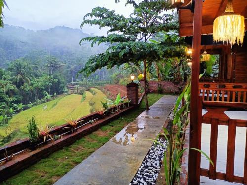a room with a view of a mountain at Villa Hening Senja Borobudur in Kayuares