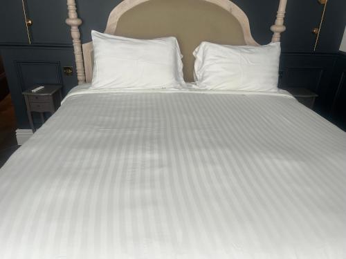 Ένα ή περισσότερα κρεβάτια σε δωμάτιο στο Eastgate Rows Apartments