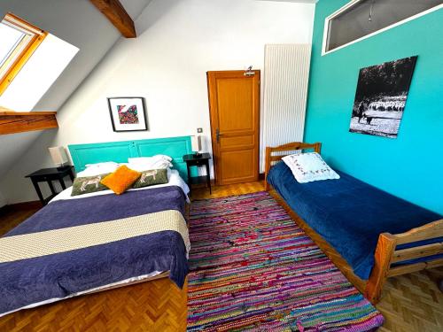 Katil atau katil-katil dalam bilik di Chambre d'Hôtes La Grange des Ecrins