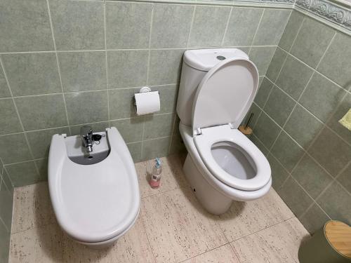 a bathroom with a toilet and a bidet at Appartement Dolores in Dolores