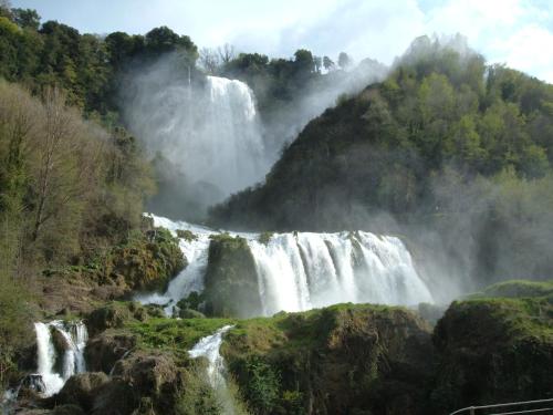 a waterfall in the middle of a mountain at Castello Miani in Otricoli
