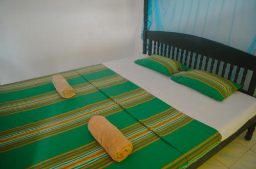 Ένα ή περισσότερα κρεβάτια σε δωμάτιο στο Glow Accommadation