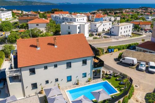 an aerial view of a house with a swimming pool at Villa LuiSole in Krk