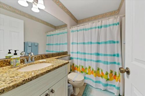 a bathroom with a sink and a toilet at Charlotte County Condo 5910 - Serenity by the River in North Port