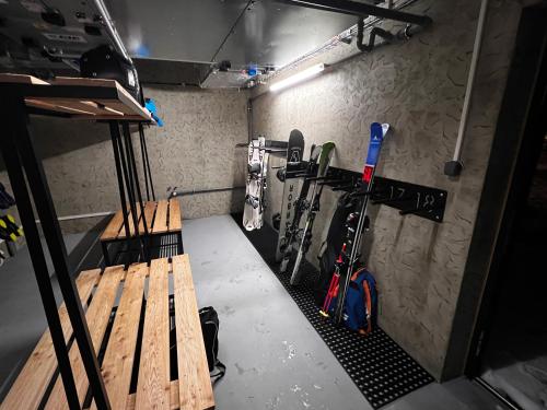 a room with skis and ski equipment in it at Apartmány Šestka in Staré Město