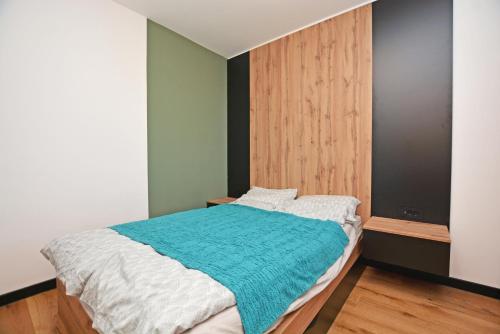 Ένα ή περισσότερα κρεβάτια σε δωμάτιο στο Winter Park Apartment