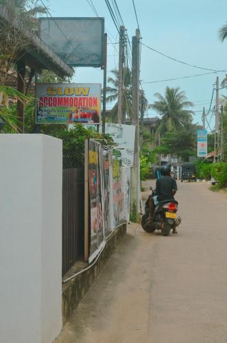 a motorcycle parked on the side of a street at Glow Accommadation in Tangalle