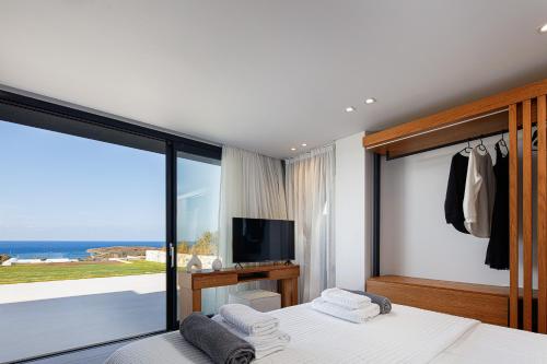 Postel nebo postele na pokoji v ubytování Villa Mika