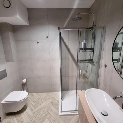 Ένα μπάνιο στο Apartament Skarbowa 1A