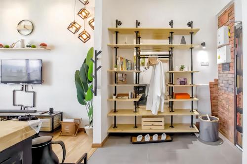a room with a shelf with a robe on it at Imperium Residence Kuantan in Kuantan