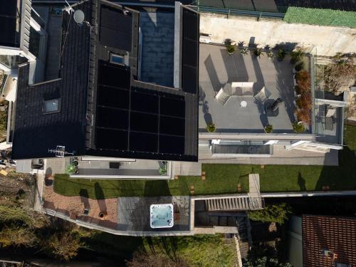 an overhead view of a building with a swimming pool at Orchidea House in Bellano