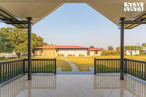 a view of the pavilion at the sylvania park at StayVista at Villa Solace with Lawn in Chandīgarh