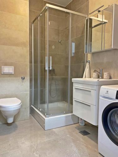 a bathroom with a shower and a toilet and a sink at Bubble in Trogir