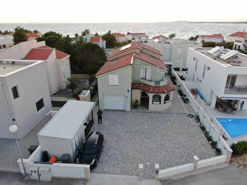 an aerial view of a house with a parking lot at Apartment ErMa in Zaton