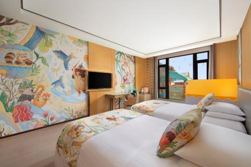 Postel nebo postele na pokoji v ubytování Courtyard by Marriott Shanghai International Tourism and Resorts Zone