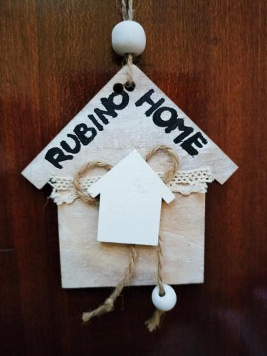 a sign that says return home with a house at rubino home in Sestri Levante
