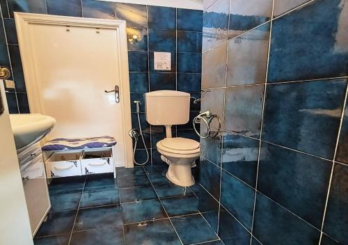 a bathroom with a toilet and a sink at Il Pittore di Stelle B&B in Boissano