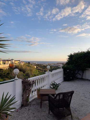 a balcony with a white railing and a bench at Rd02 La Casa Hermosa in Torrox