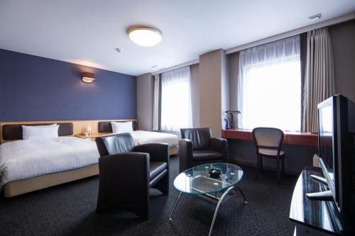 Postel nebo postele na pokoji v ubytování Hotel Odashima