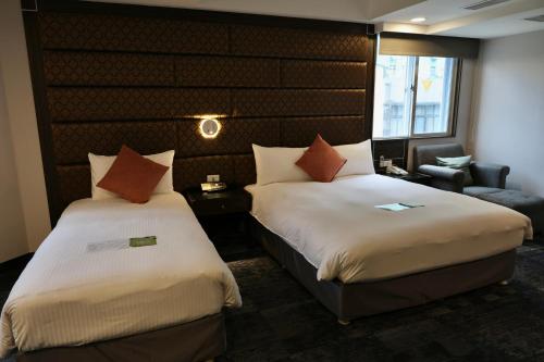 Postel nebo postele na pokoji v ubytování Hub Hotel - Zhongshan Branch