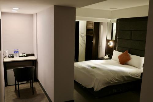 Postel nebo postele na pokoji v ubytování Hub Hotel - Zhongshan Branch