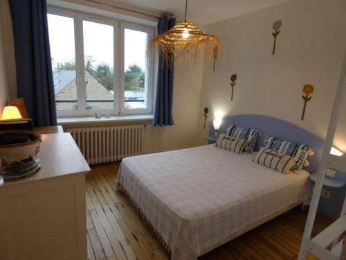 Postel nebo postele na pokoji v ubytování appartement fleurs