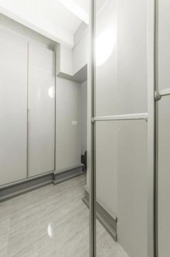an empty room with white walls and mirrors at Venice Residence in Venice