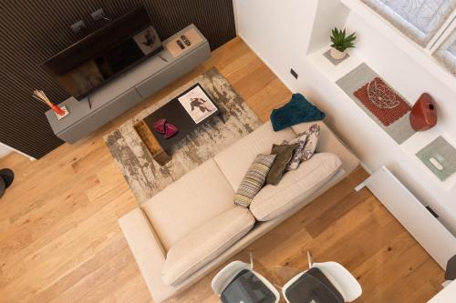 an overhead view of a living room with a couch at Mgm Property - Wonderful Loft Tartaglia in Milan