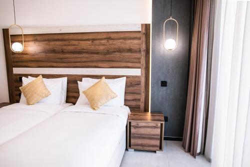 Postel nebo postele na pokoji v ubytování CA Sand Dune Hotel