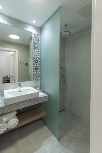 a bathroom with a sink and a mirror at Turul Villa in Sovata