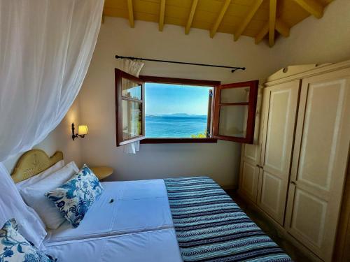 Postel nebo postele na pokoji v ubytování Villa Athena Skiathos