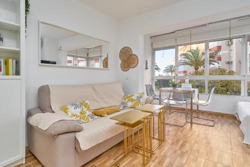 a living room with a couch and a table at Estudio Lighthouse F77 A109 in Torrox Costa