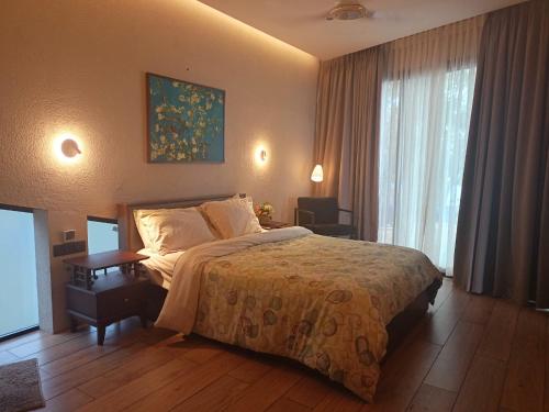 Ένα ή περισσότερα κρεβάτια σε δωμάτιο στο Green Haven Homestay