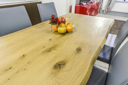 a bowl of fruit sitting on a wooden table at Venice Residence in Venice