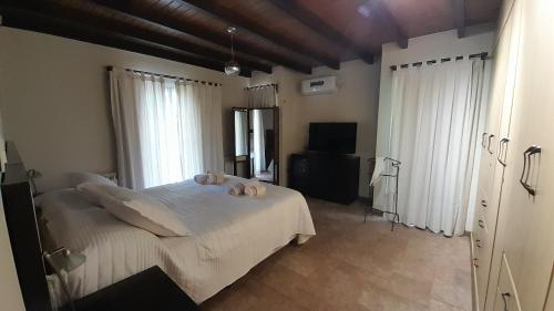 Postel nebo postele na pokoji v ubytování Casa Relax Liniers Chacras de Coria