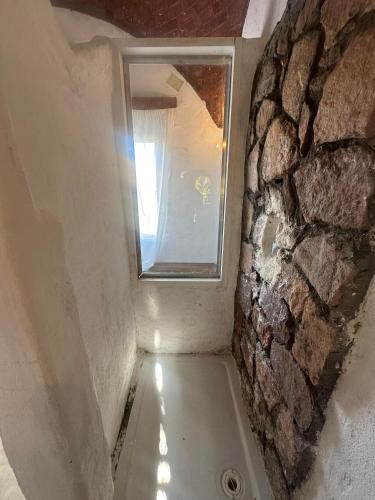 a bath tub in a room with a window at Nala Narty Boutique Hotel & Farm in Aswan